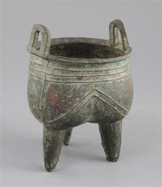 A Chinese archaic bronze tripod ritual vessel, Liding, 12th-11th century B.C., 17.5cm high